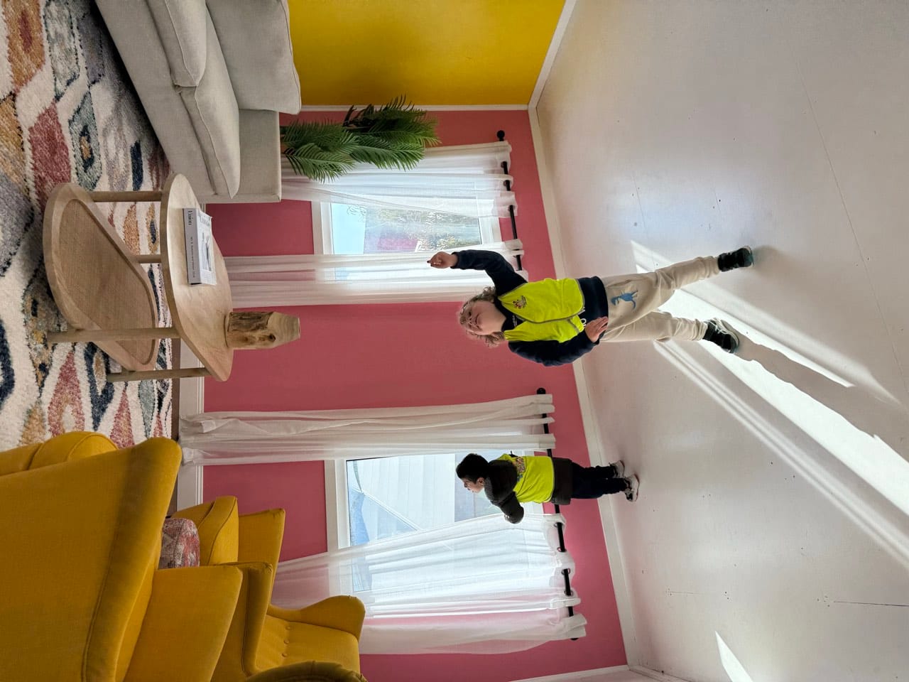 Children moving together through a centre hallway as part of a supervised transition.