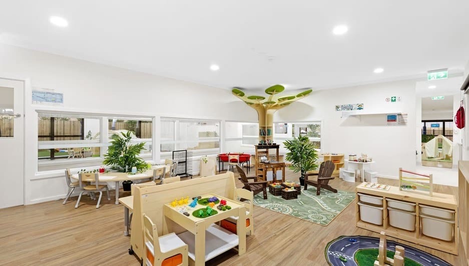 An open-plan classroom at Hoppers Crossing with inviting tables, shelves, and calm play areas.