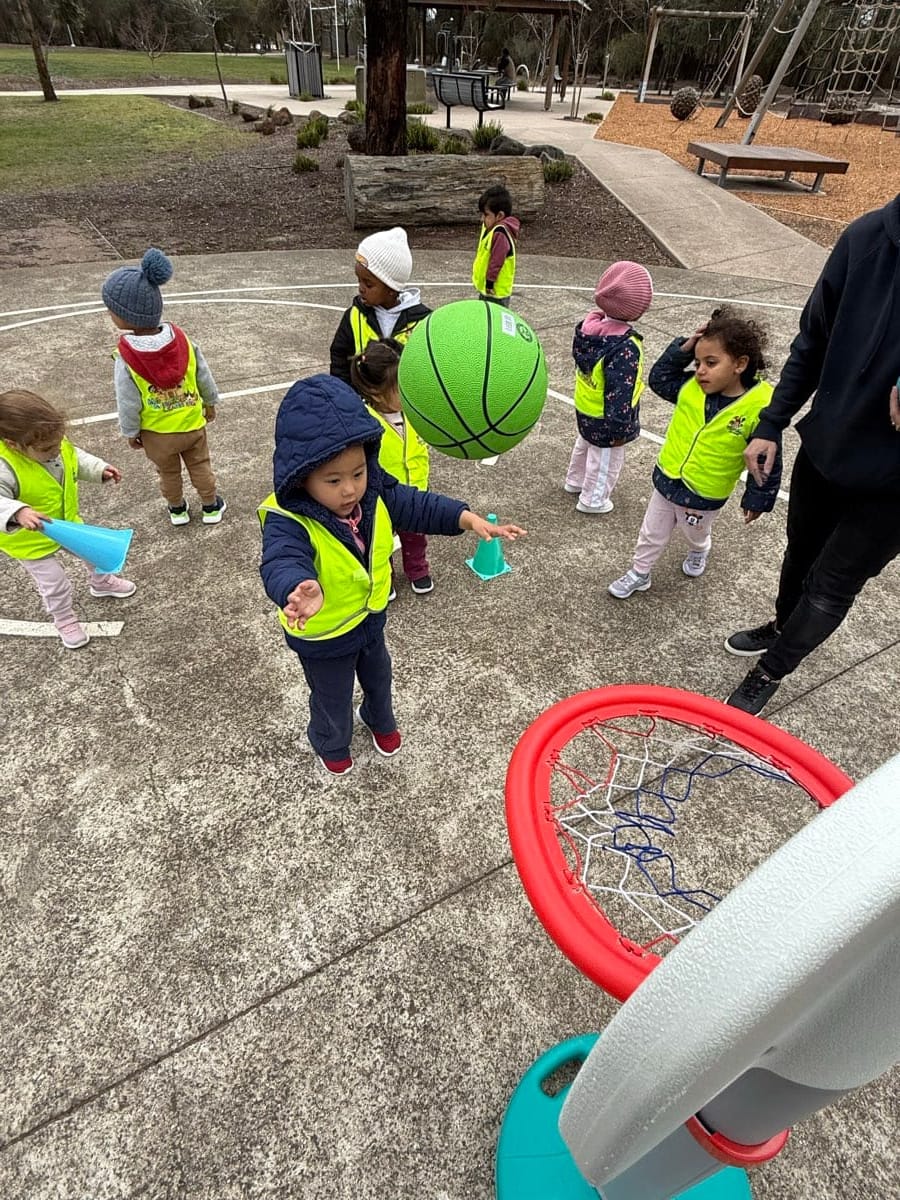 Children exploring together outdoors during a real Kids Kingdom group experience.